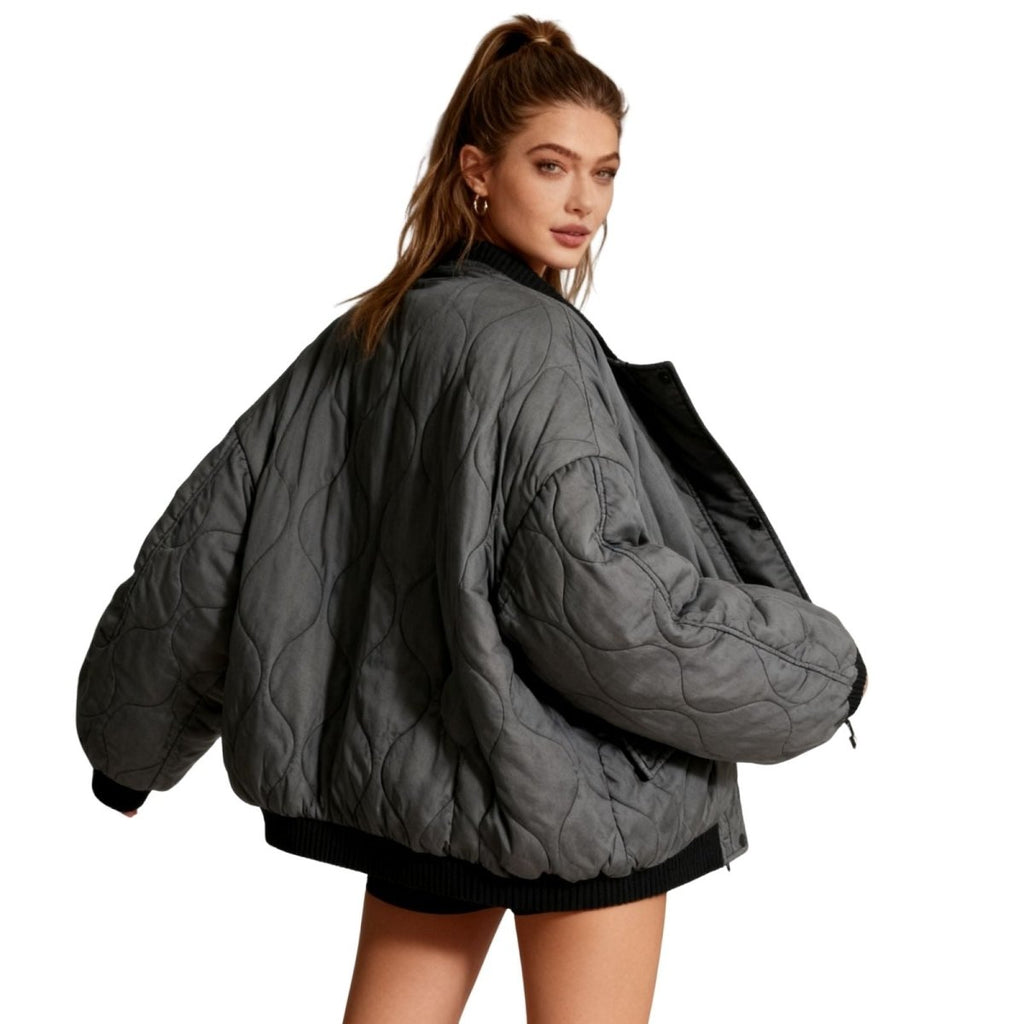 Women’s quilted cotton jacket by Les Odettes featuring an oversized charcoal design and lightweight thermal insulation.