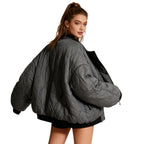 Women’s quilted cotton jacket by Les Odettes featuring an oversized charcoal design and lightweight thermal insulation.