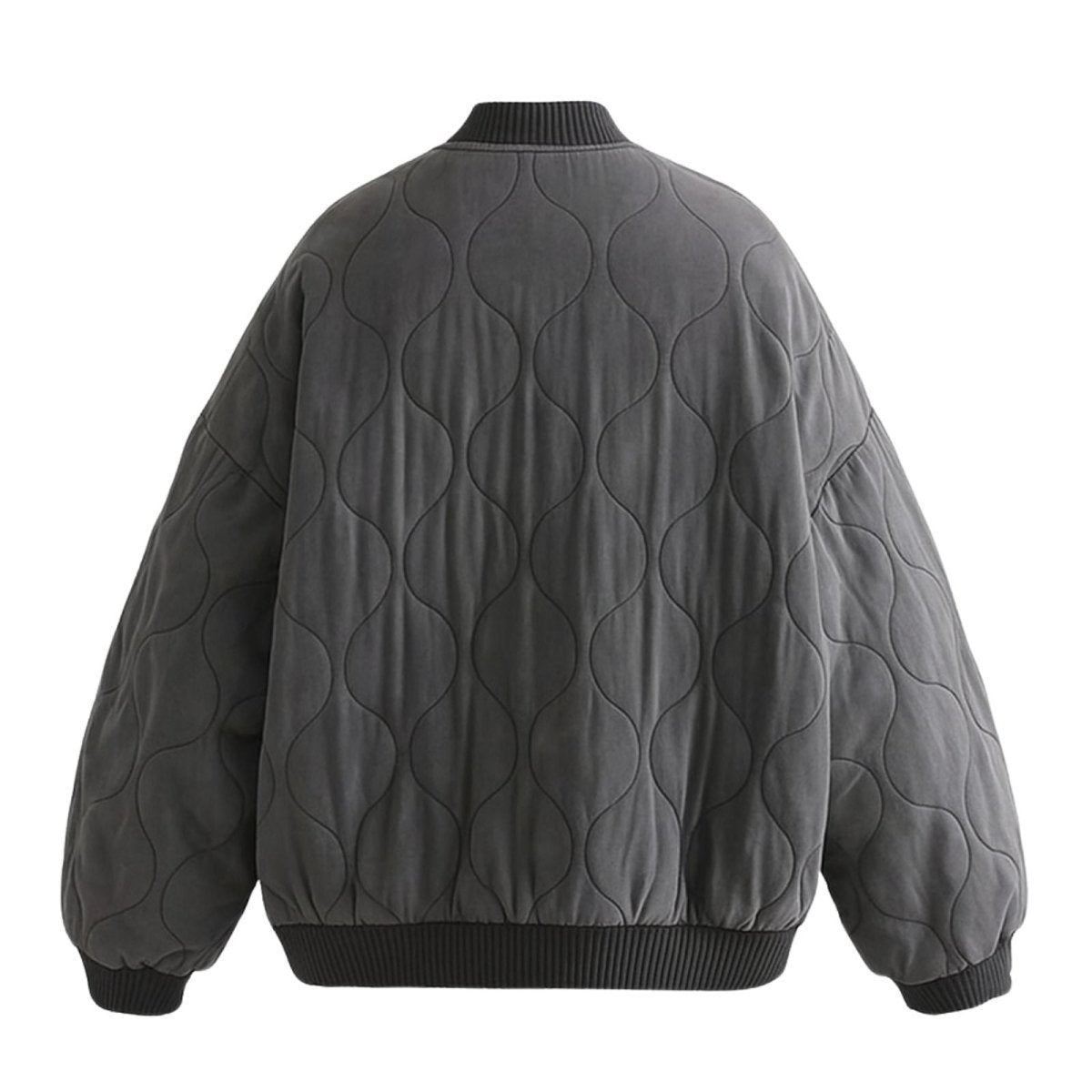 Women's quilted cotton jacket by Les Odettes, oversized charcoal bomber style with lightweight thermal insulation, shown from the back.