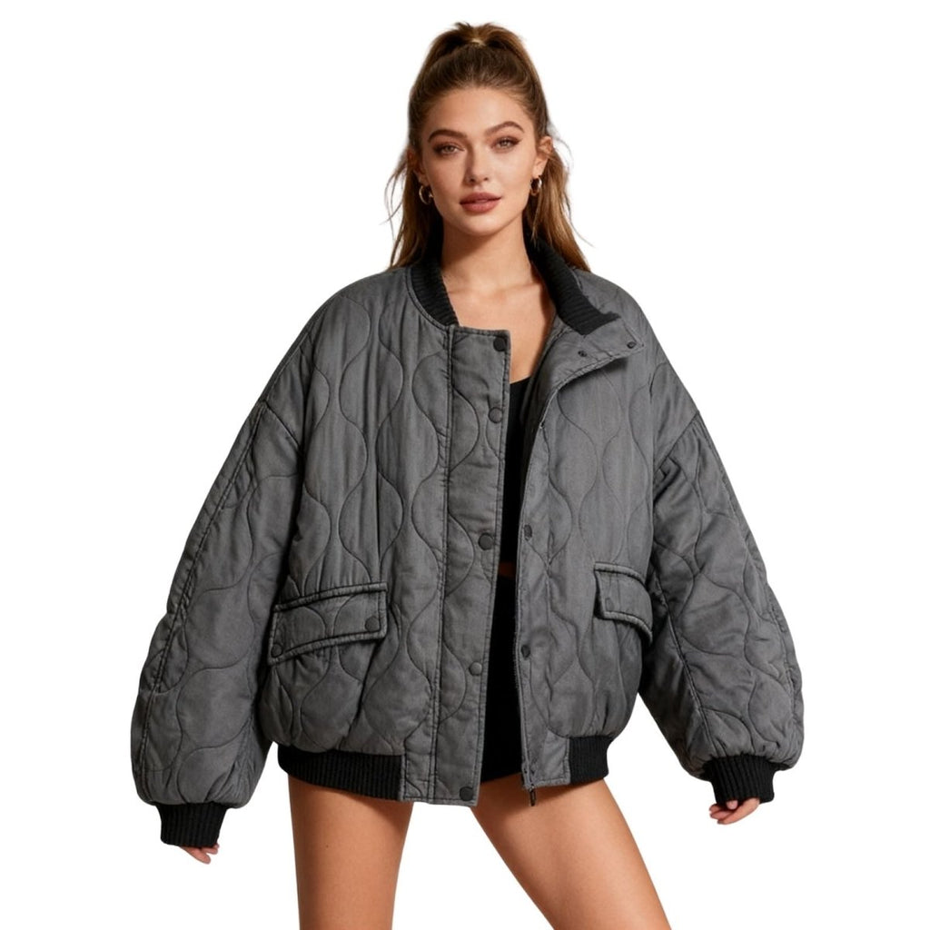 Women's quilted cotton jacket by Les Odettes, oversized charcoal thermal layer with quilted design and front closure.