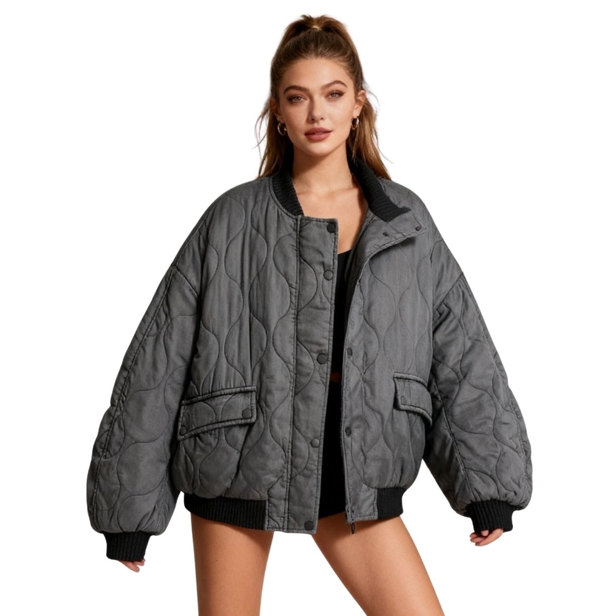 Women's quilted cotton jacket by Les Odettes, oversized charcoal thermal layer with quilted design and front closure.