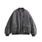 Women’s quilted cotton jacket by Les Odettes, oversized charcoal bomber with lightweight thermal layer and front zipper.