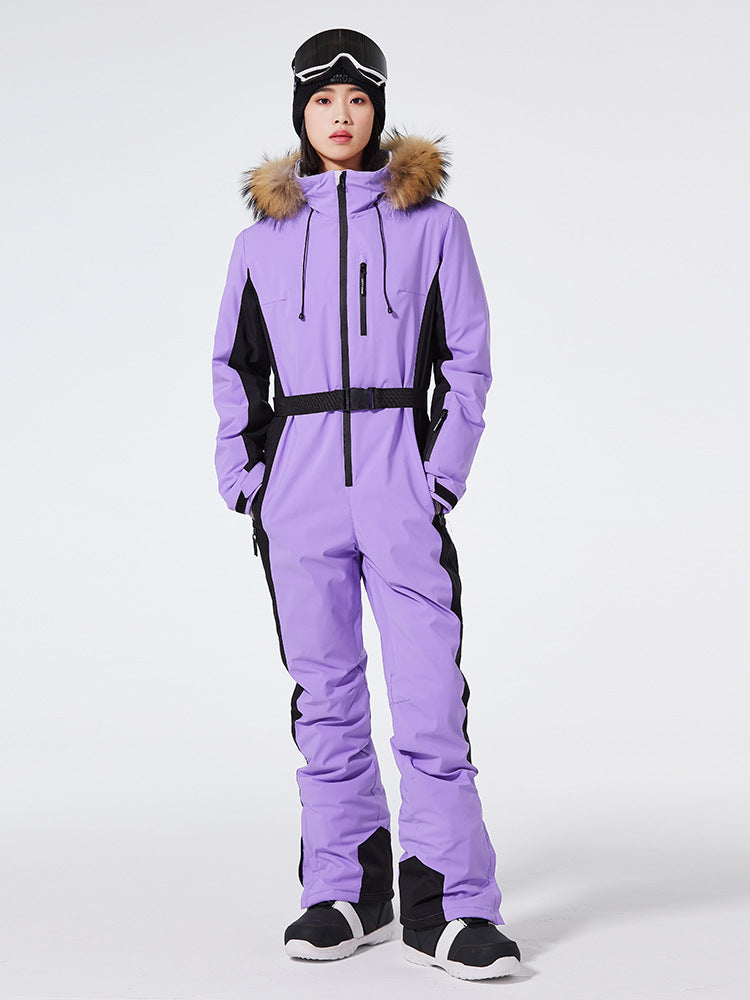Les Odettes women's Arctic Queen slim fit windproof one-piece ski suit, shown in black with hood and zipper details.