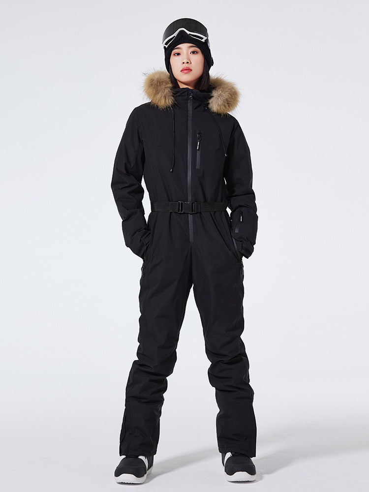 Women's Arctic Queen slim fit windproof one-piece ski suit by Les Odettes, featuring a sleek design and insulated fabric for winter skiing.