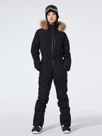 Women's Arctic Queen slim fit windproof one-piece ski suit by Les Odettes, featuring a sleek design and insulated fabric for winter skiing.