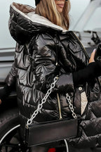 Black Raven™ winter coat by Les Odettes featuring a stylish, insulated design with a high collar and sleek silhouette.