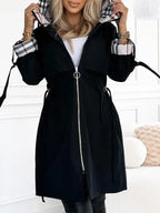 Becca™ waterproof and windproof zip coat by Les Odettes, shown in a sleek black design with a full front zipper and hood.
