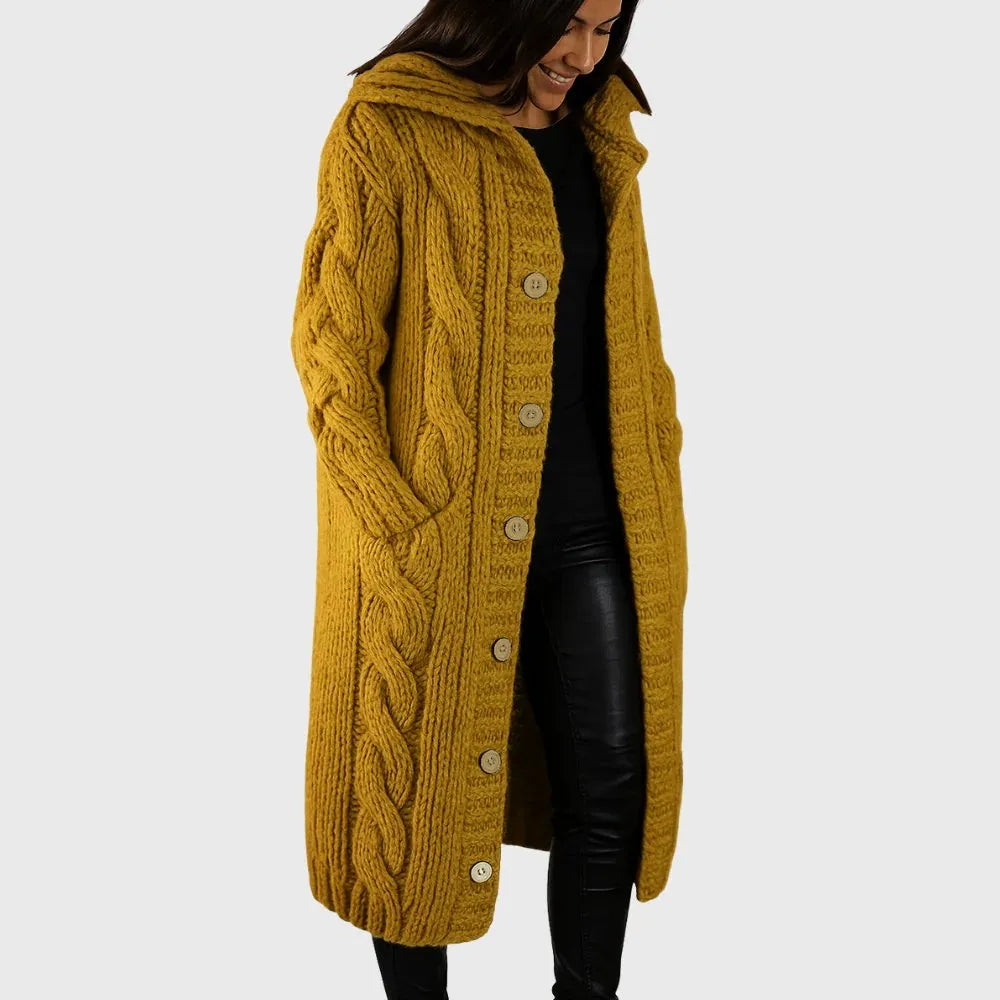 Les Odettes Cadence™ elegant cozy coat displayed on a hanger, showcasing warm fabric and stylish design for winter wear.