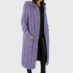 Les Odettes Cadence™ Elegant Cosy Coat displayed on a hanger with soft fabric texture and neutral color, ideal for stylish warmth.