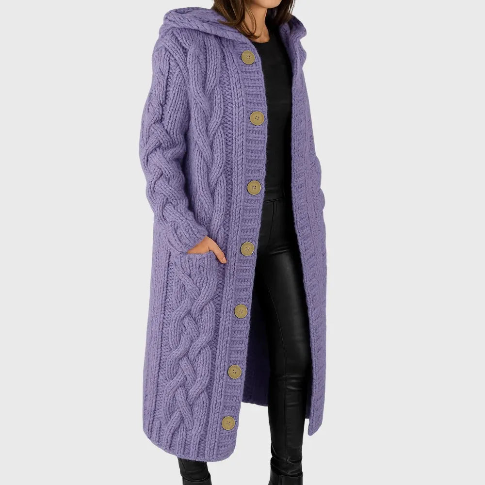 Les Odettes Cadence™ Elegant Cosy Coat displayed on a hanger with soft fabric texture and neutral color, ideal for stylish warmth.