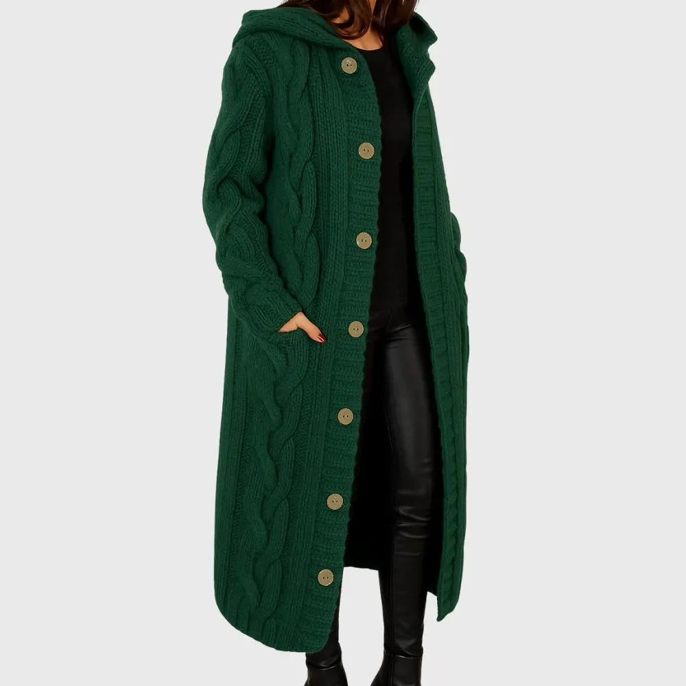 Elegant Les Odettes Cadence™ cosy coat with a soft, textured fabric in a neutral color, displayed on a hanger.