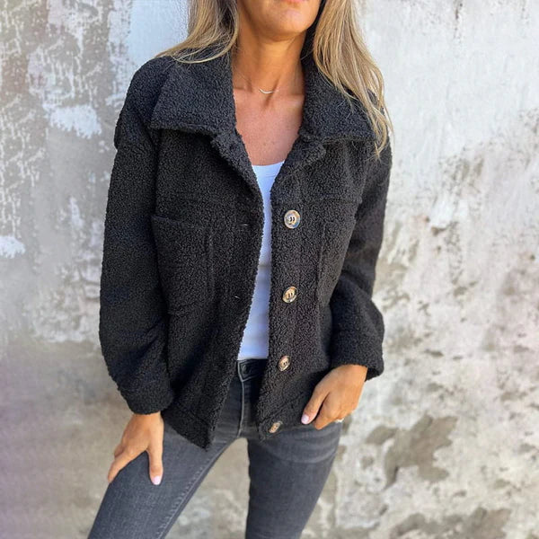 Les Odettes Marleau™ jacket with lapel collar, stylish coat featuring a tailored fit and classic lapel design.