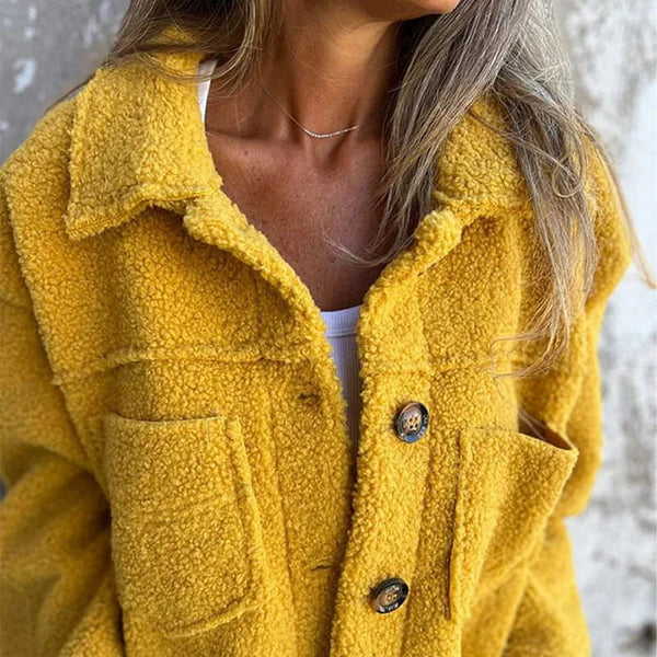 Les Odettes Marleau™ jacket with lapel collar, stylish coat featuring tailored lapels and a sleek design for modern fashion.