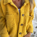 Les Odettes Marleau™ jacket with lapel collar, stylish coat featuring a classic lapel design and tailored fit.