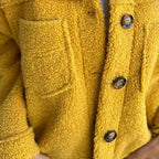 Les Odettes Marleau™ jacket with lapel collar, stylish coat featuring a tailored fit and classic design.