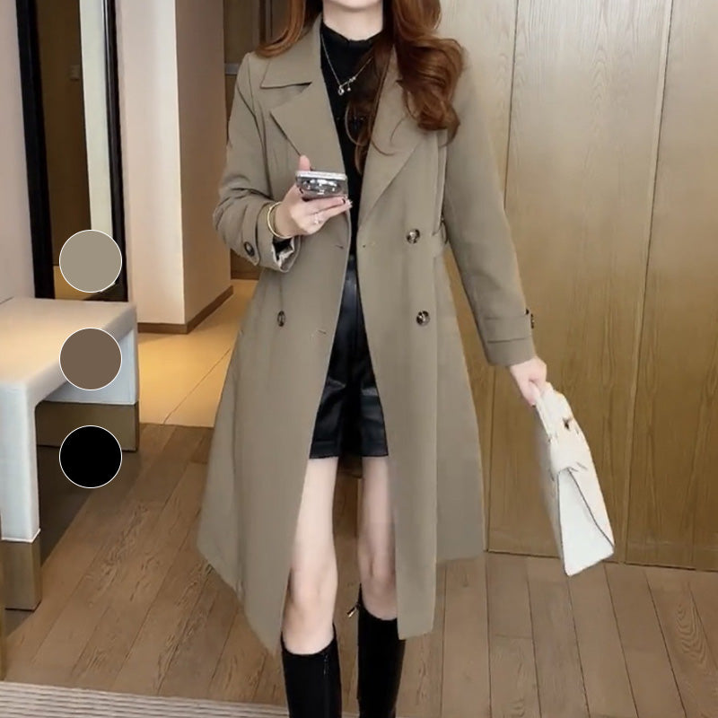 Les Odettes Stella™ sophisticated trench coat in beige, shown on a model with classic lapels and a belted waist.